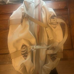 Elegant Beige Travel Bag with Patterned Accents